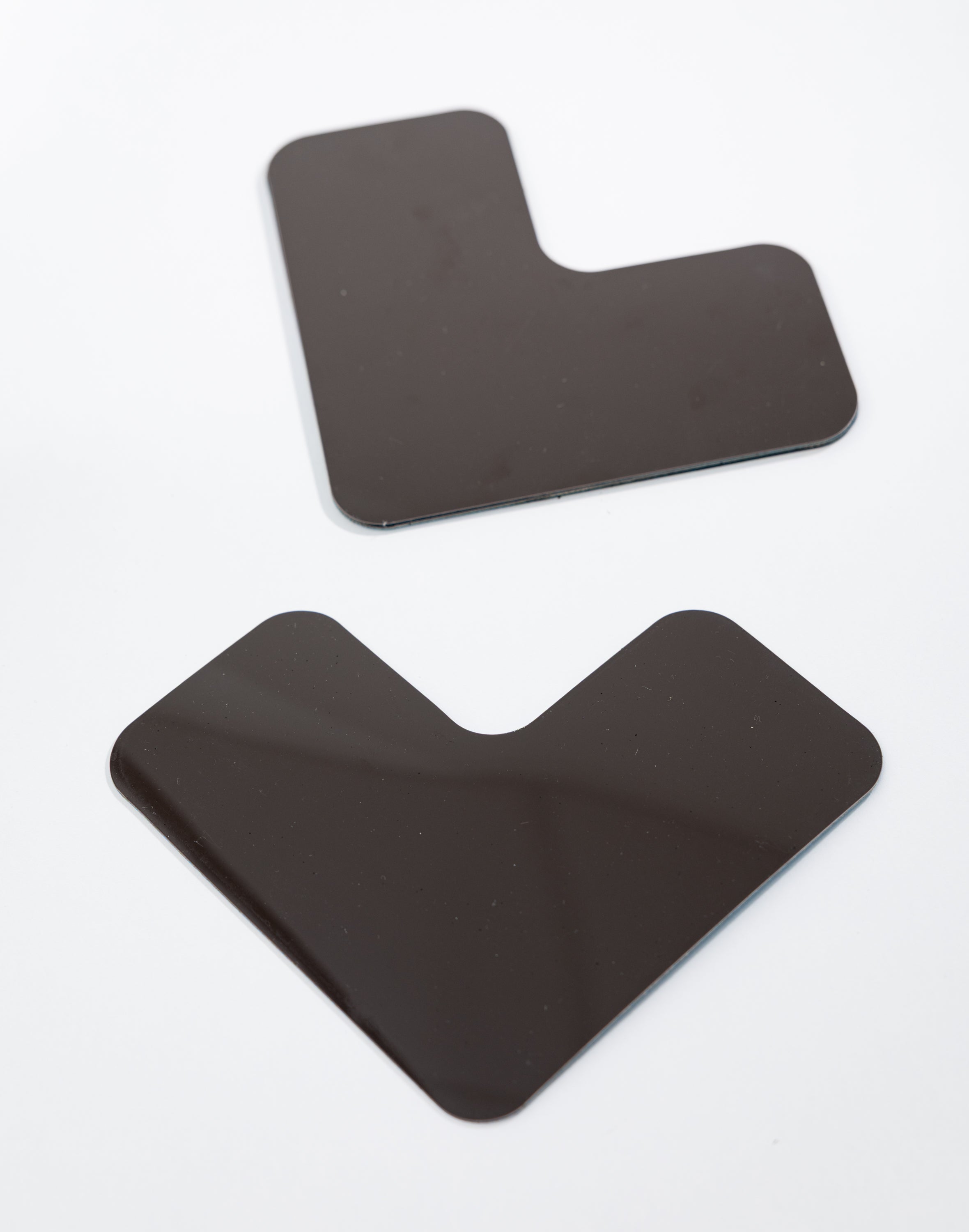 Two black sticker mats