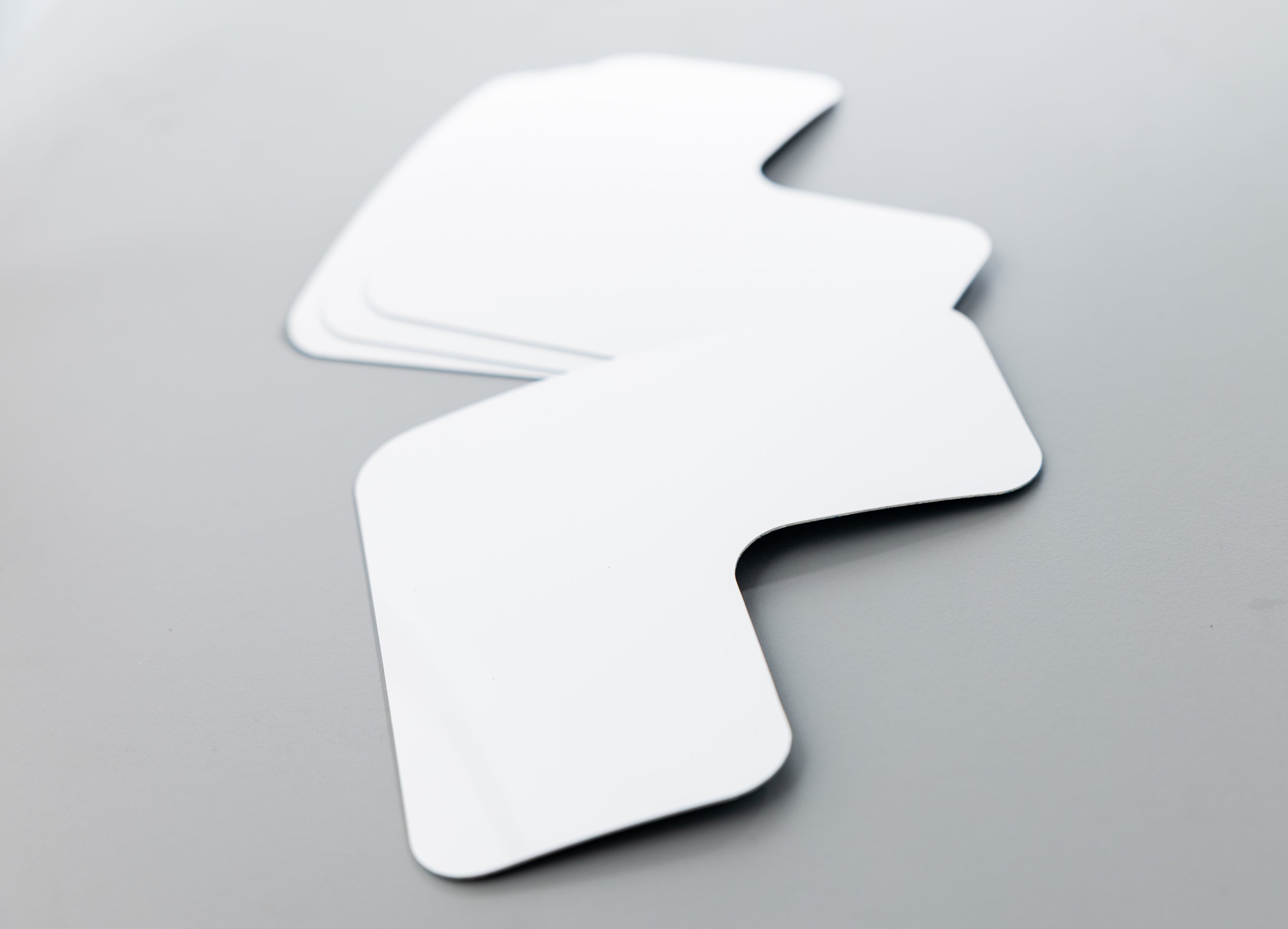 Two white arrow-shaped